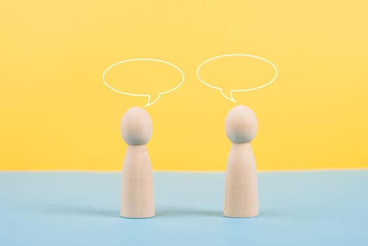Two people talking together, empty speech bubbles, having a conversation, networking and teamwork concept, social issue