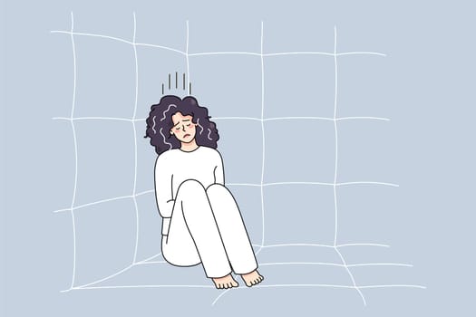 Unhappy sick woman in straitjacket sit on floor in psychiatric clinic suffer from mental disorder. Upset ill female patient or madhouse struggle with psychiatric issues. Vector illustration.