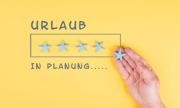 Progress bar with sea stars, holiday loading ist standing on the paper, planning a trip for the weekend, vacation and travel concept, german language
