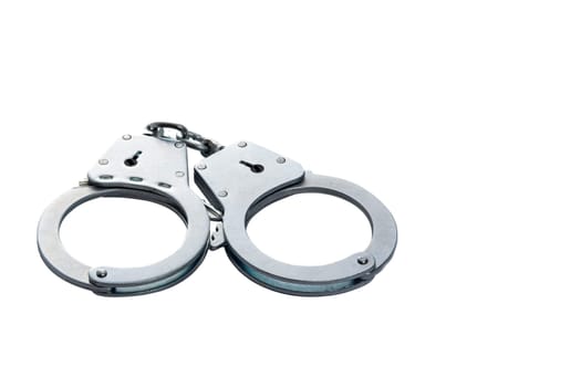 Metal handcuffs on a white isolated background, copy space. High quality photo