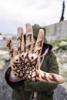 Detail of arabic decoration on the hands, temporary tattoo