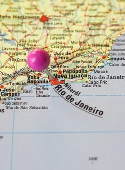 Pushpin marking on Rios de Janeiro, Brazil. Selective focus on city name