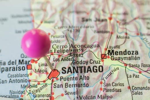 Pushpin marking on Santiago de Chile. Selective focus on city name