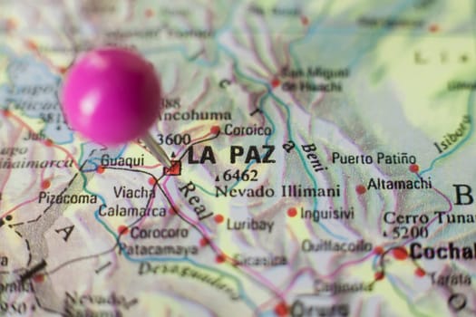 Pushpin marking on La Paz, Bolivia. Selective focus on city name