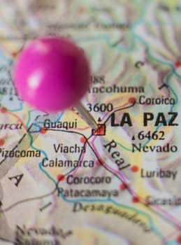 Pushpin marking on La Paz, Bolivia. Selective focus on city name