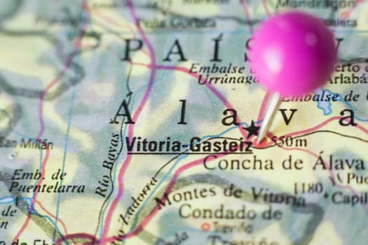 Pushpin marking on Vitoria-Gasteiz, Spain. Selective focus on city name