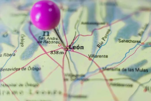 Pushpin marking on Leon, Spain. Selective focus on city name