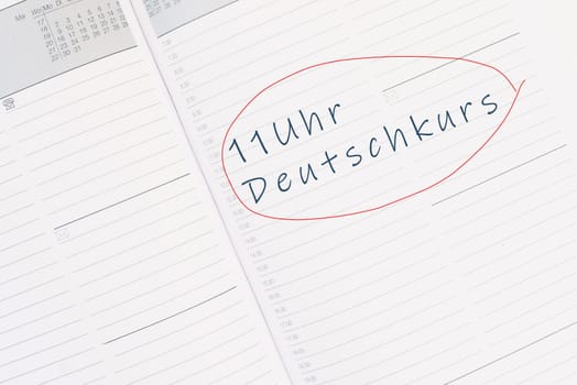 The words german course at 11 o´clock are standing in the german language in the calendar, education and integration concept