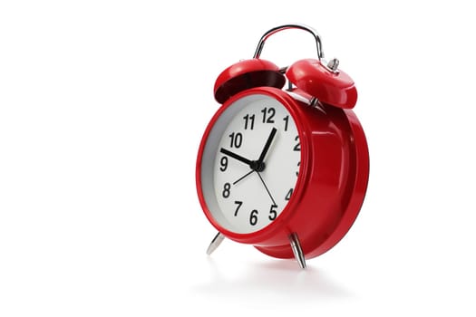 A red retro alarm clock in white with shadow