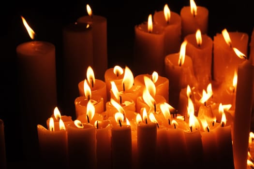Lighting candles in chapel of Our Lady from the Kamenita vrata (Stone Gate) in Zagreb to remember and honor the deceased loved ones