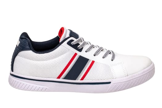 White sneakers isolated. Close-up of a single white elegant stylish leather sport shoe isolated on a white background. Clipping path. Kids shoe fashion. Modern design footwear for workout. Macro.