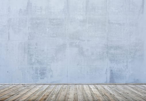Empty room or loft with wooden floor and concrete wall