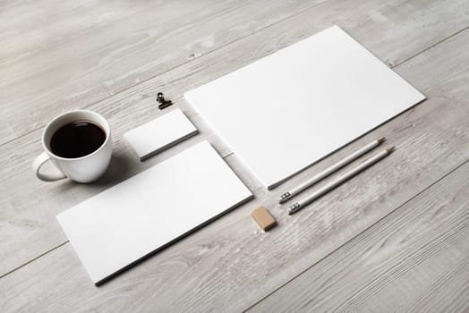 Blank corporate identity template on wooden background. Photo of blank stationery set. Mockup for design presentations and portfolios.
