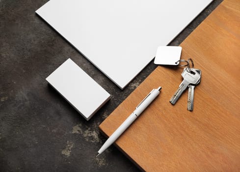 Blank corporate stationery set, keys and wooden board. Mockup for branding identity for designers.