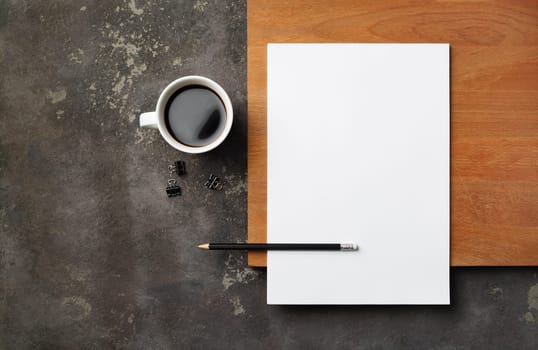 Blank stationery: letterhead, pencil and coffee cup. Blank objects for placing your design. Copy space for text. Flat lay.
