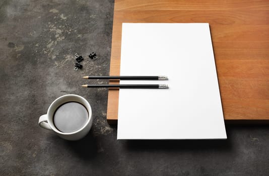 Blank stationery set. Blank letterhead, pencils, coffee cup and clips.
