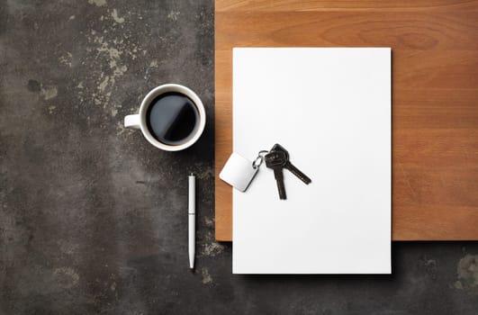 Documents for real estate. Blank letterhead, keys, pen and coffee cup. Flat lay.