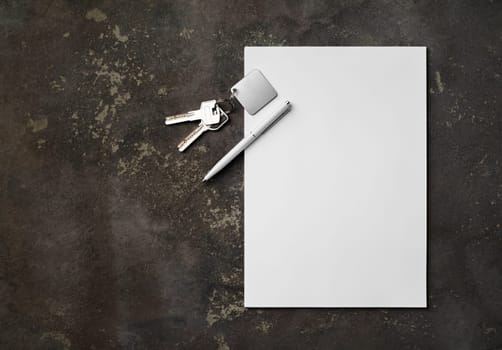 Blank letterhead, key and pen on concrete background. Copy space for text. Flat lay.