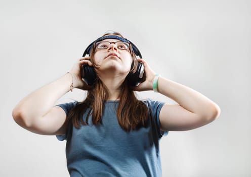 Girl enjoying music with headphones. Teen girl listening to music.
