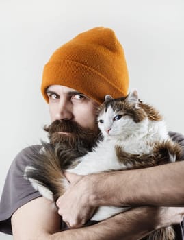Hipster and cat. Bearded man with his beloved cat.