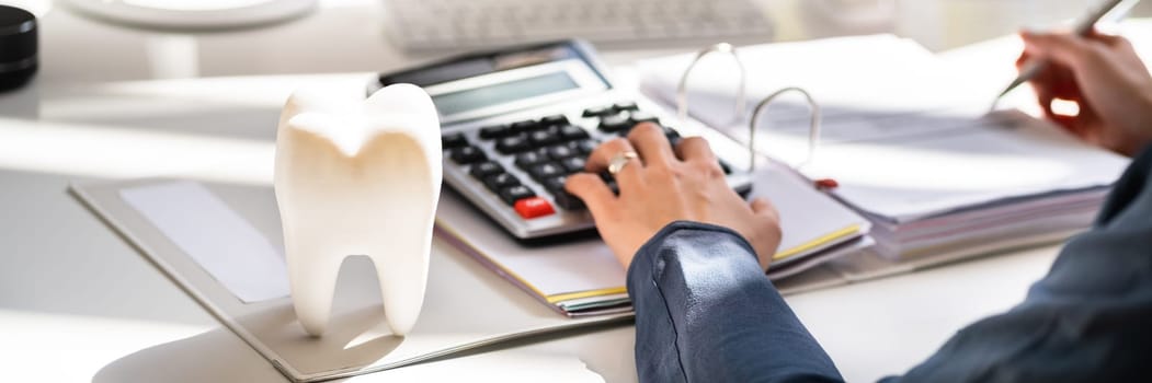 Dentist Bill And Tax Paperwork At Desk