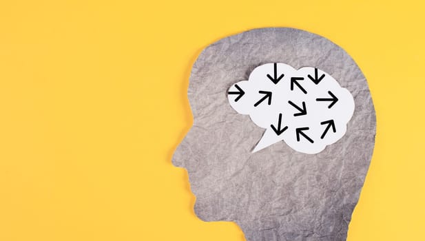 Think different, yellow background, head with brain, being a nonconformist, standing out from the crowd, brainstorming for ideas