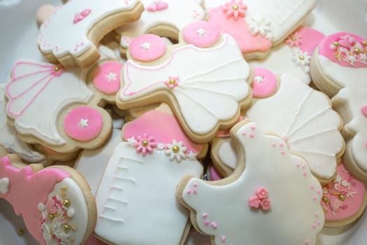 Platter full of baptism or christening cookies. Overhead view