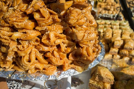 Platter crammed with chebakia. Deep-fried moroccan pastry