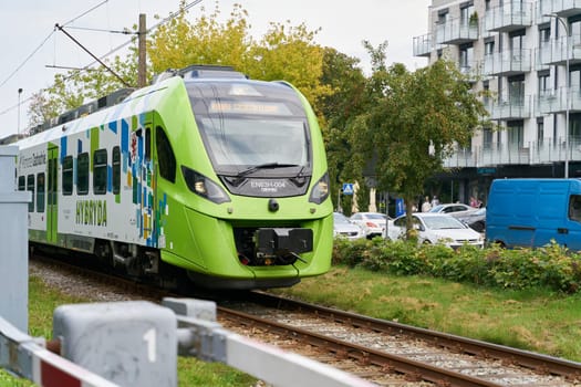 Regional train to Szczecin at a railroad barrier in the center of Kolobrzeg in Poland