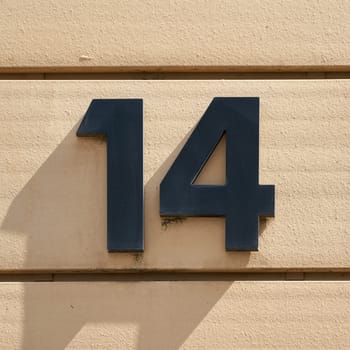 House number 14 on the facade of a house in Magdeburg in Germany