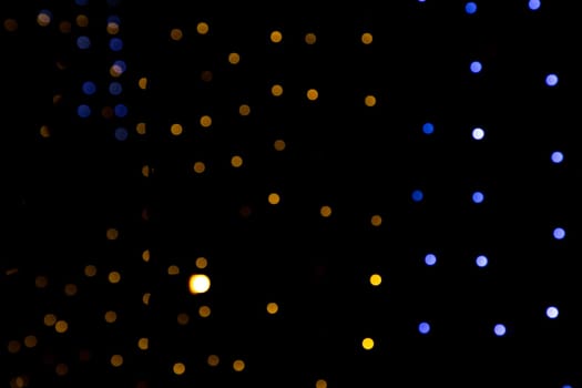 Black background with golden light effects. background with  Blur bokeh effects. Abstract background texture