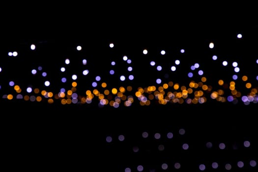Black background with golden light effects. background with  Blur bokeh effects. Abstract background texture
