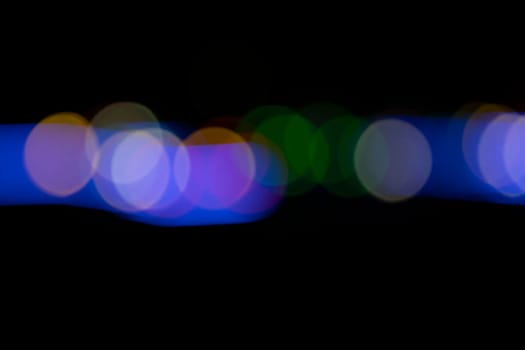 Black background with colorful light effects. background with  Blur bokeh effects. Abstract background texture