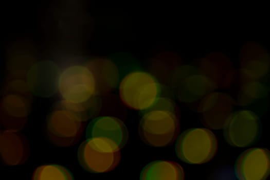 Abstract bokeh light effects on the night. Black background with colorful light effects. background with  Blur bokeh effects. Abstract background texture