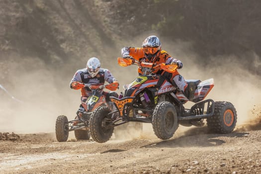 MOHELNICE,  CZECH REPUBLIC - APRIL 16, 2022: Quad bike rider jumping in the turn  in International Championship of Czech Republic in Sidecarcross, category Quad on April 16, 2022 in Mohelnice.