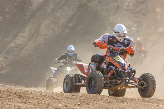 MOHELNICE,  CZECH REPUBLIC - APRIL 16, 2022: Riders on a quad bike in left turn in International Championship of Czech Republic in Sidecarcross, category Quad on April 16, 2022 in Mohelnice.