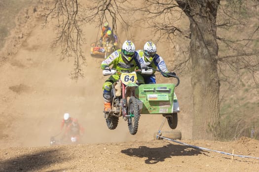 MOHELNICE, CZECH REPUBLIC - APRIL 16, 2022. Motorbike are jumping in the race"Sidecarcross Championship of Czech Republic"" on April 16, 2022 in the town of Mohelnice."