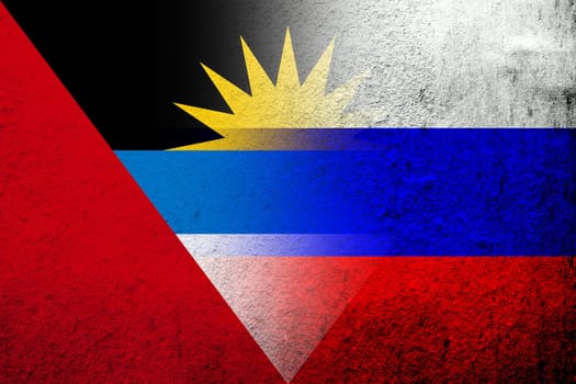 National flag of Russian Federation with National flag of Antigua and Barbuda. Grunge background