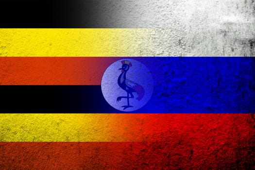 National flag of Russian Federation with The Republic of Uganda National flag. Grunge background