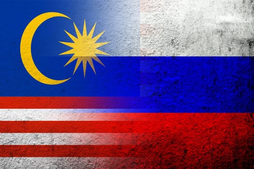National flag of Russian Federation with National flag of Malaysia. Grunge background