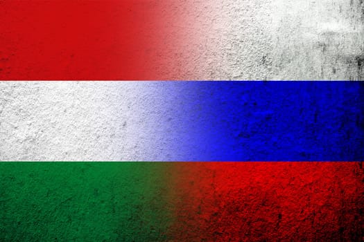 National flag of Russian Federation with National flag of Hungary. Grunge background