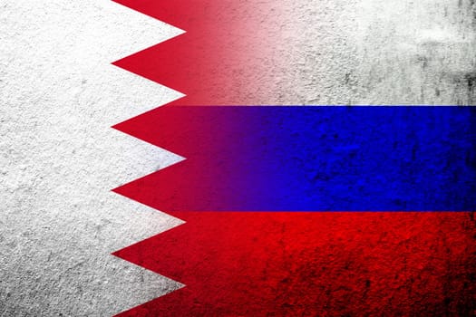 National flag of Russian Federation with The Kingdom of Bahrain national flag. Grunge background