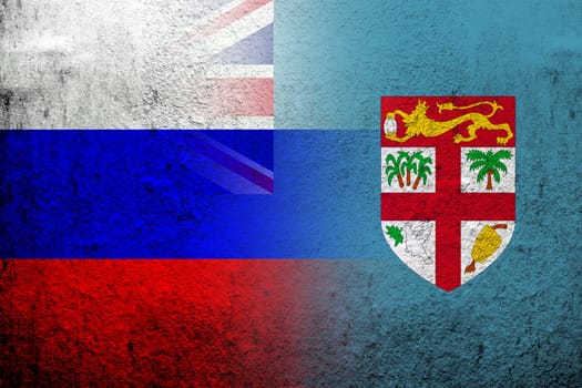 National flag of Russian Federation with The Republic of Fiji National flag. Grunge background