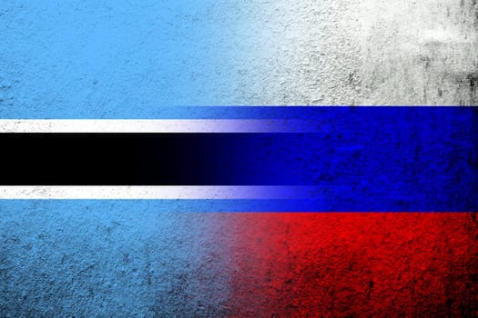 National flag of Russian Federation with The Republic of Botswana National flag. Grunge background