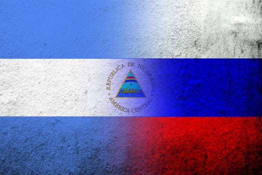 National flag of Russian Federation with The Republic of Nicaragua National flag. Grunge background