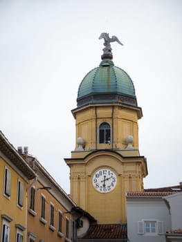 Facades of the Korzo street in Rijeka, croatia, with the city tower, or gradski toranj, a baroque clocktower from the 19th century, and a major landmark of Rijeka
