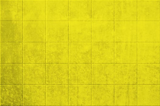 Dirty wall background with yellow tiles