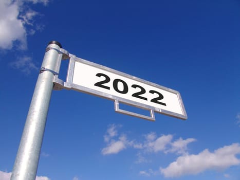 Street sign showing year 2022 with blue sky