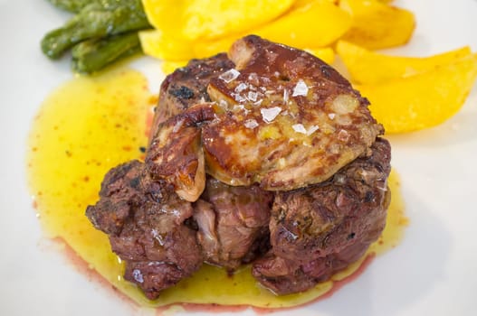 Grilled veal tenderloin with foie au gratin. Closeup