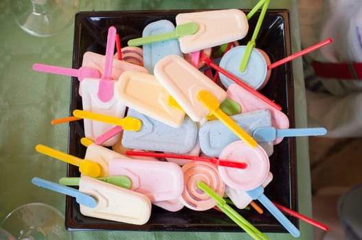 Platter full of candied ice lolly-shaped. Overhead view of candy buffet